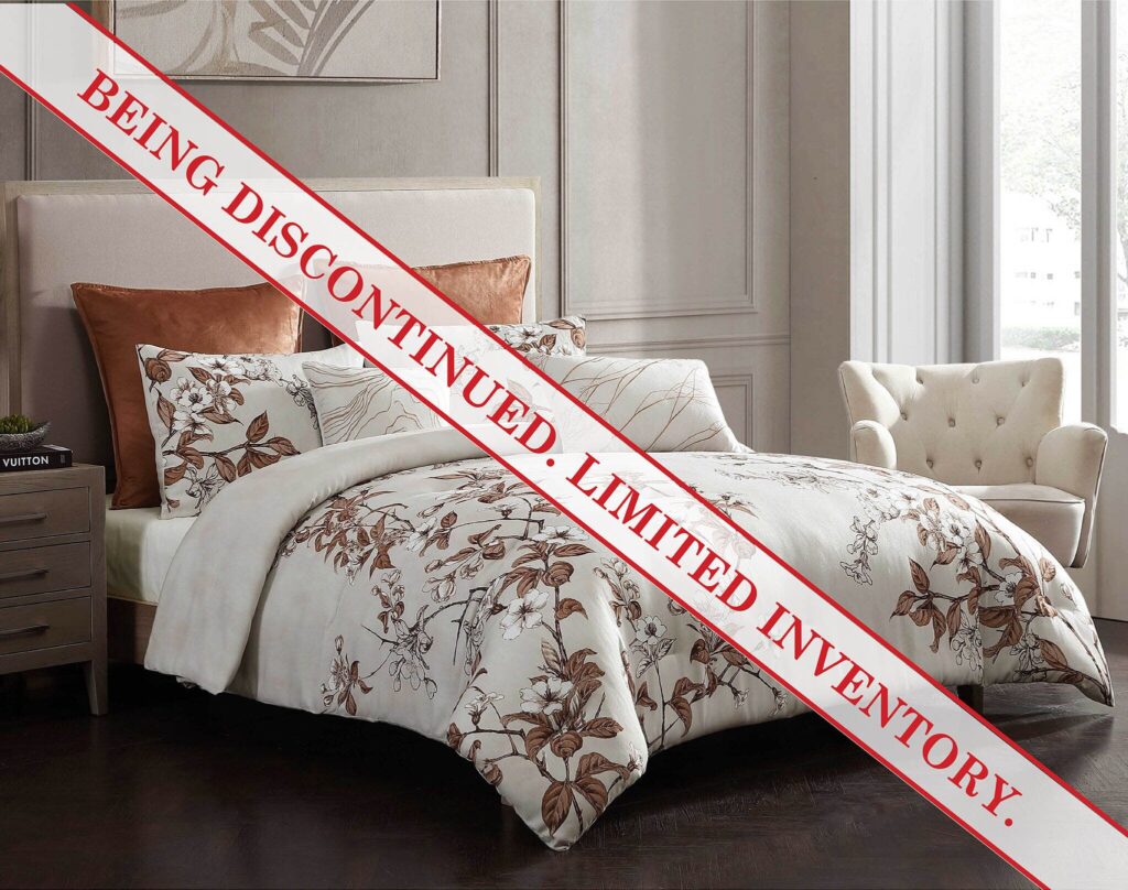 A bedroom scene with a floral-patterned quilt, beige headboard, and a red-and-white 'DISCONTINUED' tape diagonally across the bed.