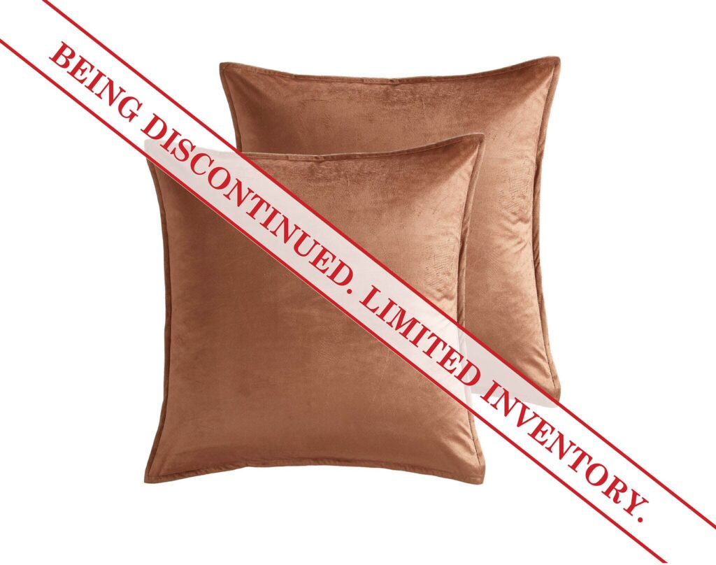 Brown velvet pillow with a red diagonal discount banner across it, indicating a sale